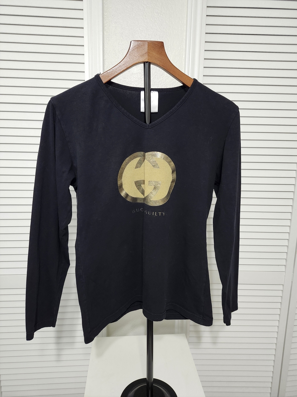 Black Long-Sleeve V-Neck Top with Gold Logo